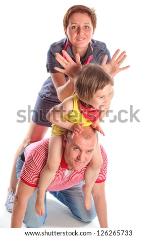 the father, mother and the small daughter in studio on a white background the isolated