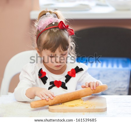 girl in the kitchen baking cakes