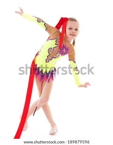 Adorable little gymnast dancing with ribbon.Isolated on white background.