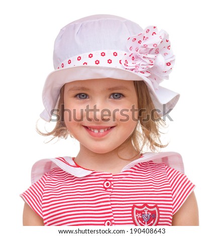 Portrait of a beautiful little girl in striped pink dress and hat on a white background