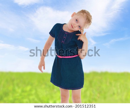 Portrait of a girl in a summer field.spring season,fun outdoors,happy childhood,sweet child having fun outdoor,smiling toddler portrait