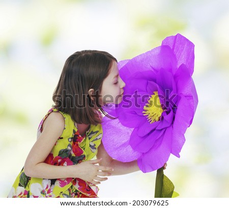 girl in a red paper flower.floral bouquet, flowers delight,happiness concept,happy childhood,carefree childhood,active lifestyle