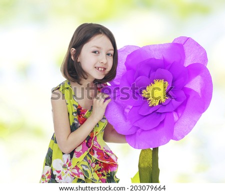 girl in a red paper flower.floral bouquet, flowers delight,happiness concept,happy childhood,carefree childhood,active lifestyle