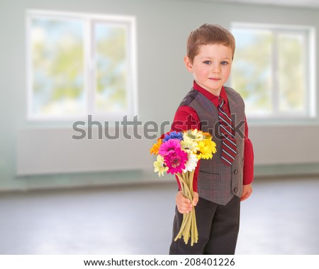 boy gives flowers.kindergarten, the concept of childhood and joy, teens