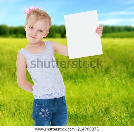 girl holding a square white sheet on which you can write something