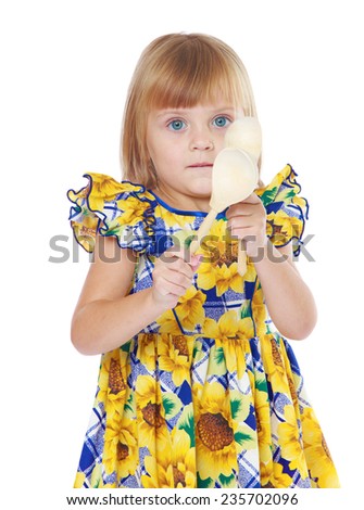 Early years, knowledge of the world, learning concept.Adorable little girl in a yellow dress.Isolated on white background.