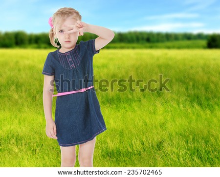 Girl showing sign of victory.Summer background.summer mood.