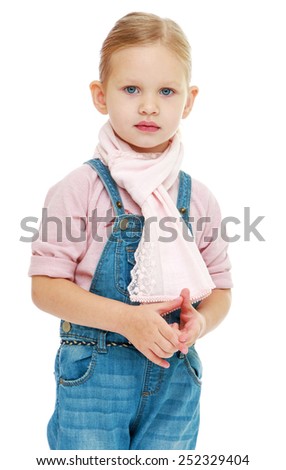 Close up of little girl in denim overalls.Isolated on white background, Lotus Children's Center.