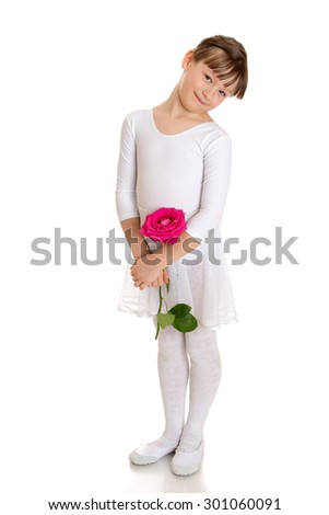 Beautiful girl of school age, in a white sports swimsuit holding a big rose.-Isolated on white background