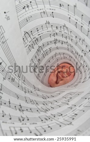 ear wrapped in a sheet with music notation