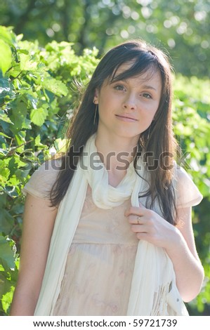 Young woman taking a walk in the park on a sunny day