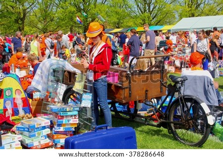 SOEST, NETHERLANDS - April 27. People sell stuff at the Vrijmarkt, a second hand market on Koningsdag on April 27, 2014 in Soest. Near Amsterdam. Kingsday is the birthday of King Willem Alexander.