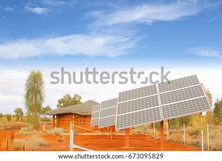 Solar power panels, renewable energy production and house in red desert landscape