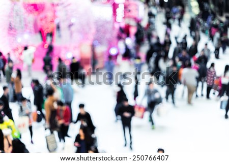 Blurred crowded people in shopping mall
