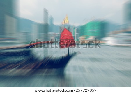 Motion blurred Hong Kong Junk Boat for background / color tone tuned