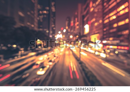 Abstract bokeh light background of city night with vignette vintage color tone tuned