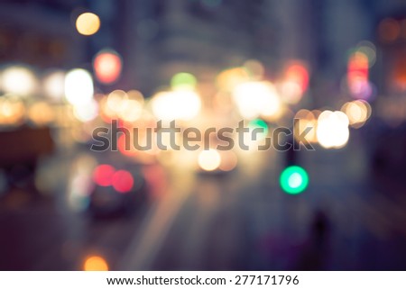 Bokeh city raining background with vintage color tone tuned
