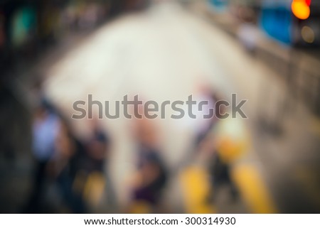 Blurred crowded city background with vintage color tone tuned