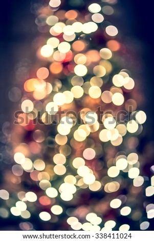 Bokeh Xmas lighting background with vintage color tone