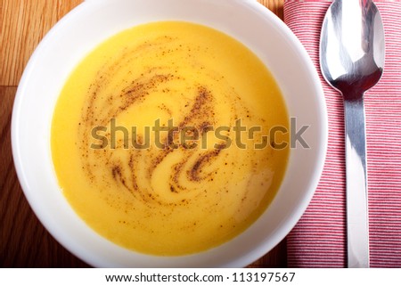 pumpkin and leek cream soup served in a bowl