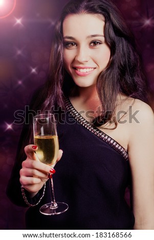 Beautiful and elegant girl with a glass of champagne at a party. Light effects.