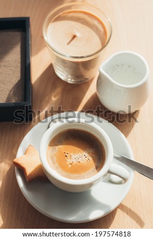Espresso macchiato served in a cafeteria table