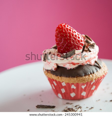 Strawberry cupcake with chocolate in a dish