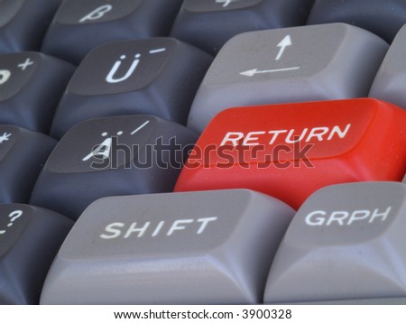Red return/enter-key on computer keyboard