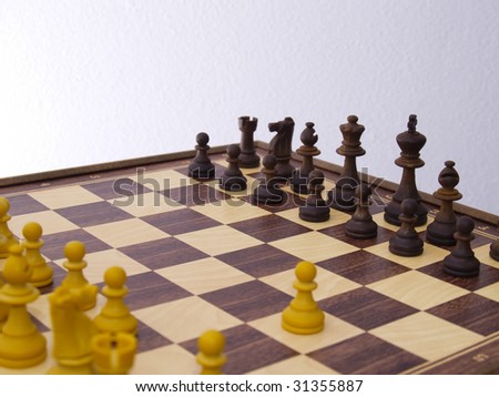 Chess board in the beginning of game, with first draw done