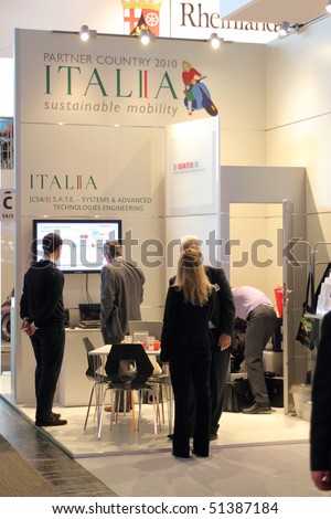HANNOVER, GERMANY - APRIL 19: people on the stand of italy, this years partner country, at the hannover industrial fair , Hannover Messe April 19, 2010 in Hannover, germany