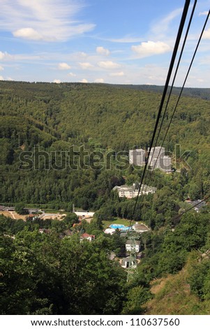 BAD HARZBURG, GERMANY - JULY 28: view along the cables of mount burgberg cable car to the bad harzburg valley station  , Burgberg June 28, 2011 in Bad Harzburg, Germany