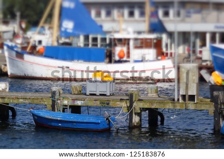 small boat in the harbor of burgstaaken, fehmarn, germany