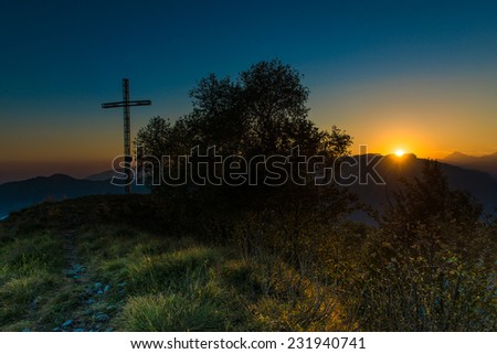 summit cross at sunset