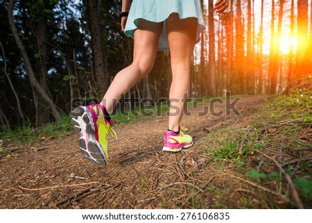 Youths sporty woman walking in the woods