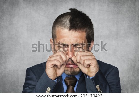 businessman is crying because he lost work