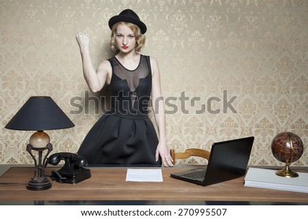 angry business woman threatens fist