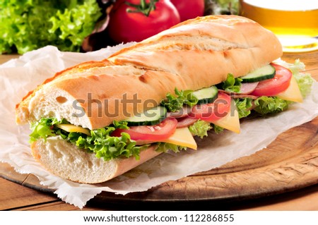 Ham And Cheese Salad Submarine Sandwich From Freshly Cut Baguette.