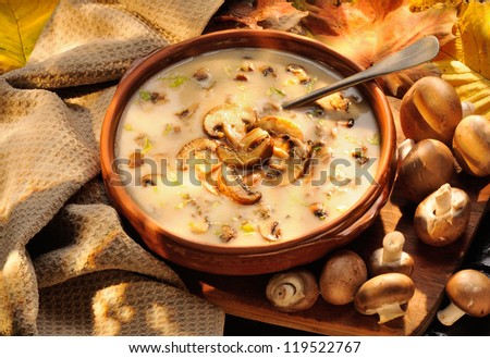 Cream of mushroom soup. Home-made, country style with whole and sliced mushrooms.