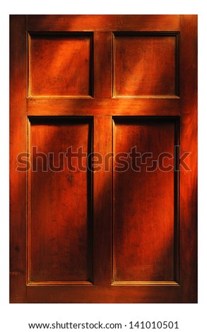 Antique wood paneled door lit by rays of light. Suitable as background.