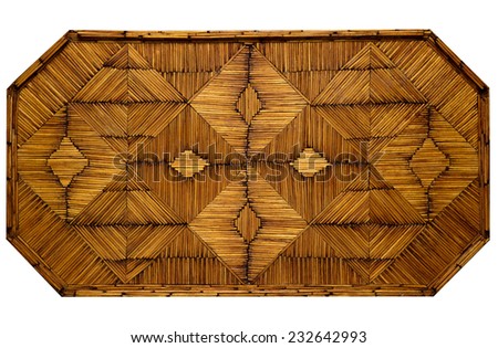Rustic , decorative geometric pattern serving tray created from used wooden matchsticks. Vintage golden honey color wooden background.