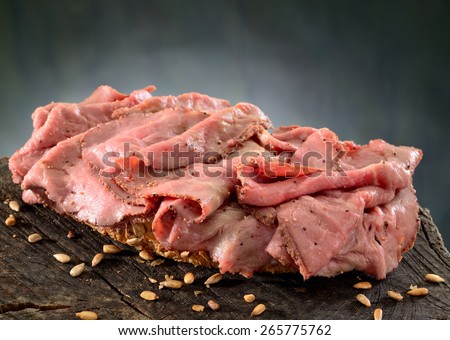 Beef sandwich.  Roast beef, thinly sliced on fresh whole grain bread.