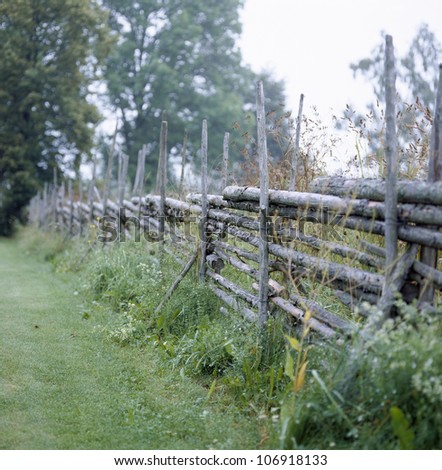 An old fence on the countryside, Sweden.