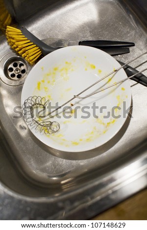Dirty dishes in a washing-up zink, Sweden.