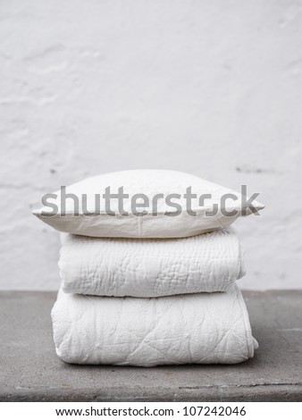 Scandinavia, Sweden, Stockholm, Folded blankets and quilt, close-up