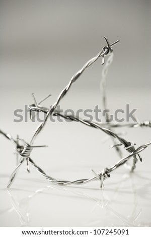 Barbed wire against a white background, Sweden.