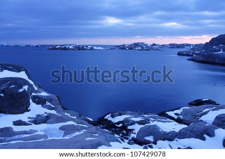 Snow on the cliffs by the sea, Smogen, Sweden.