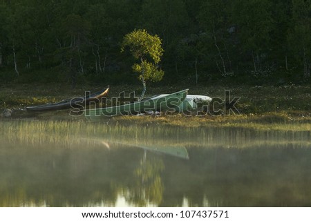 Rowboats by a lake, Finland.