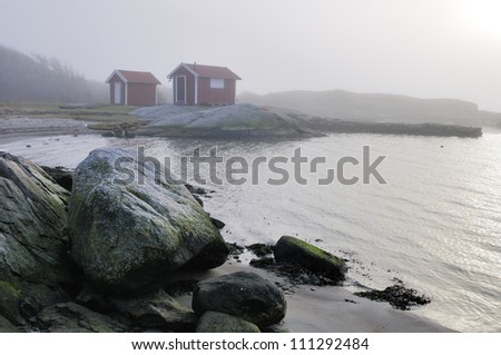 Boathouse in the fog by the sea, Sweden