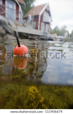 Float with a house in the background, Sweden