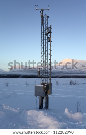Weather station in snowy landscape